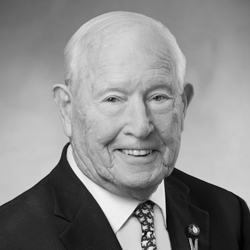 John R. Lacey, C.M.