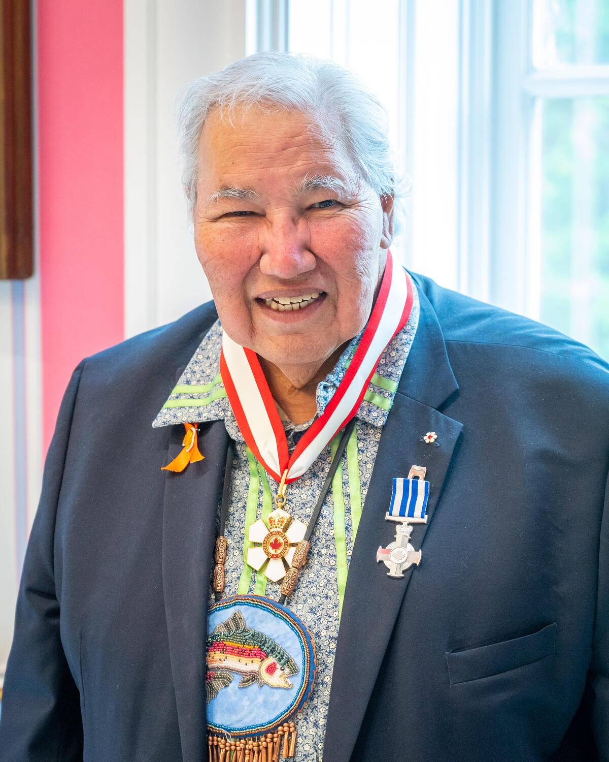 Mr. Murray Sinclair smiling at the camera, wearing is Order of Canada and other honours decorations.